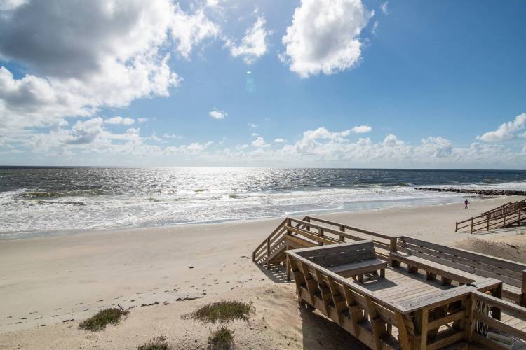 A view of the beach from a tide life vacation rental