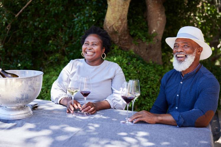 A couple pose for a picture while wine tasting